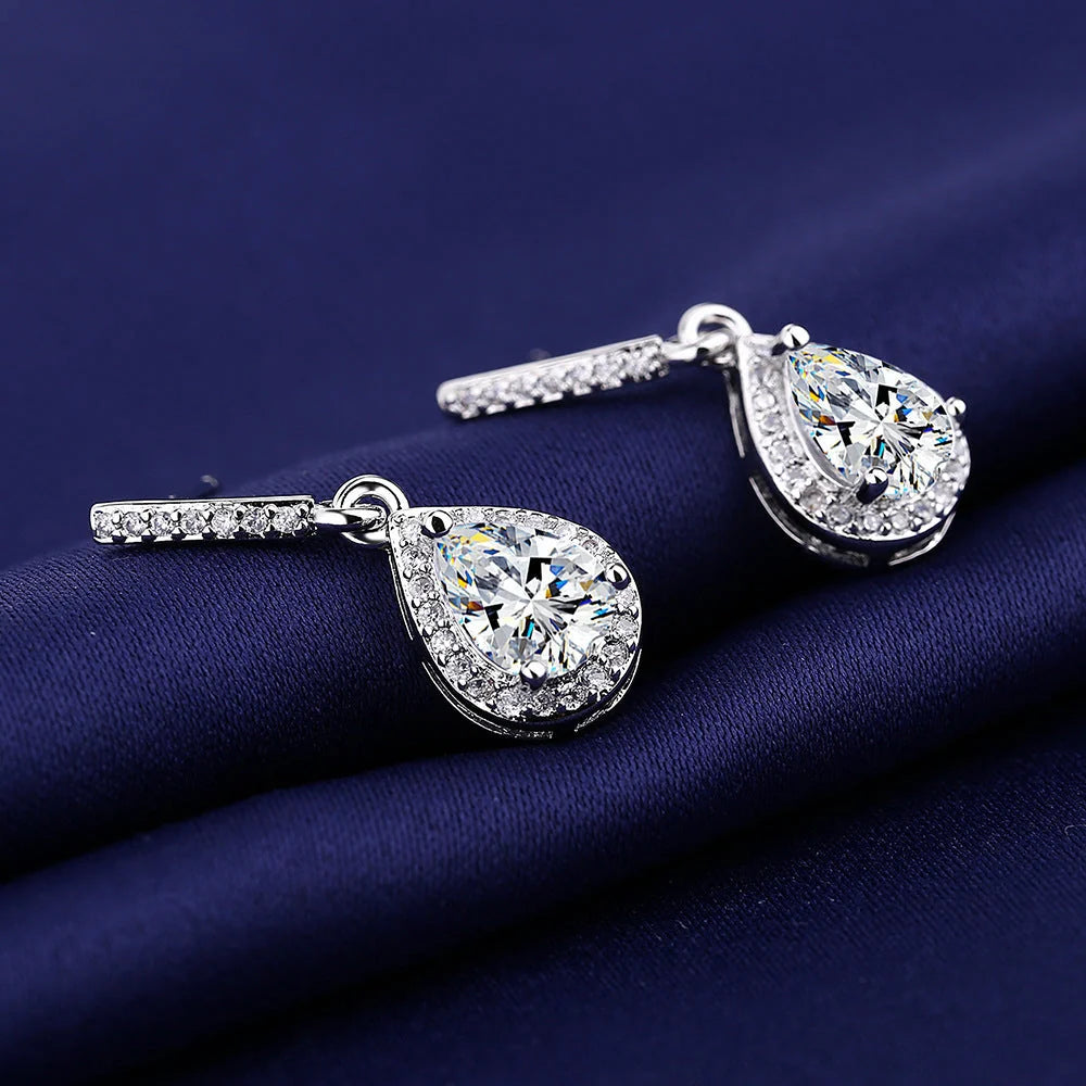 Elegant drop-shaped earrings featuring shimmering zircon stones in a variety of colors, including white, yellow, blue, and red diamond.