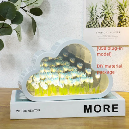 DIY tulip-shaped night lamp kit with LED lights and mirror surface in assorted colours on a desk.