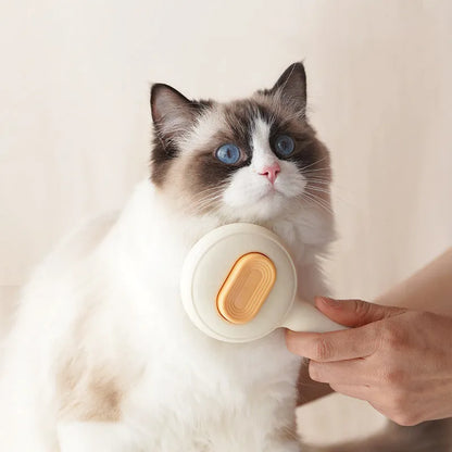 Cat grooming brush with stainless steel teeth and non-slip handle in green or yellow colour options