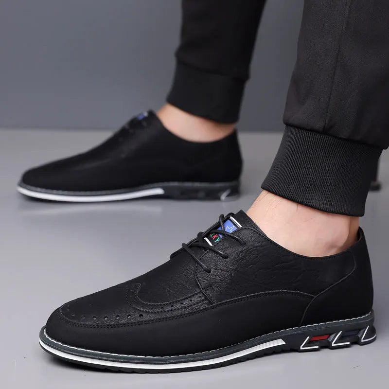 Men's black leather casual shoes with a leather toe cap and rubber sole on a white background.