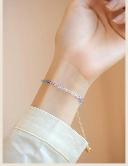 Women's handmade bracelet with rainbow fluorite stones in copper geometric quadrilateral settings