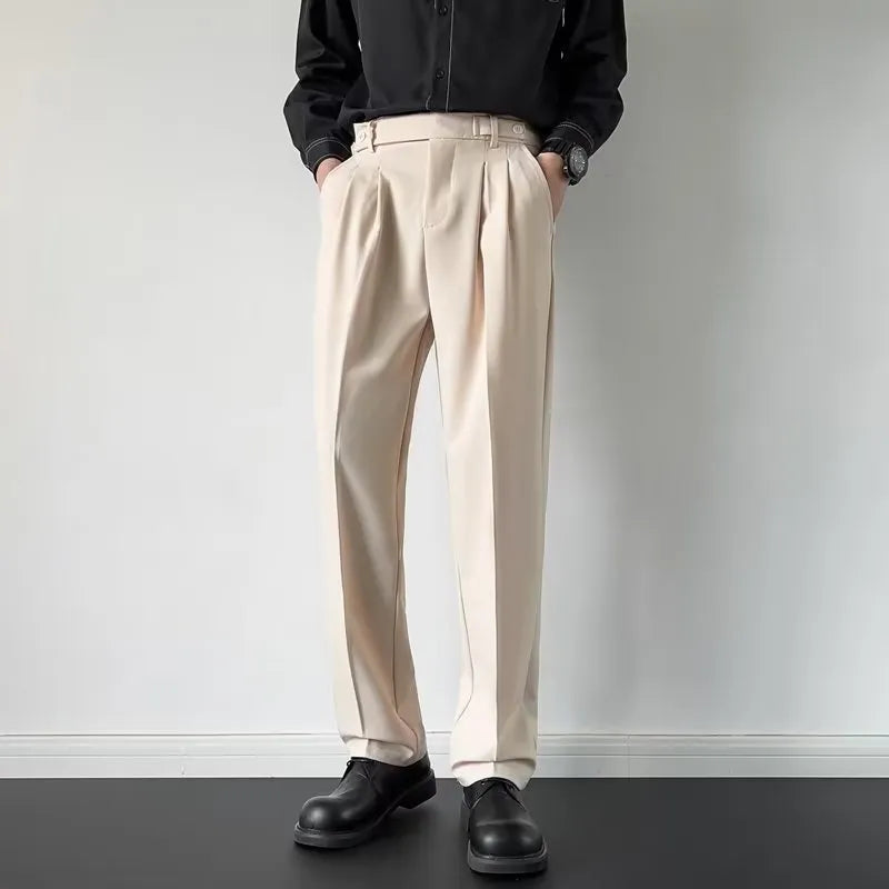 Men's apricot and black straight-leg loose fit suit trousers on a hanger.