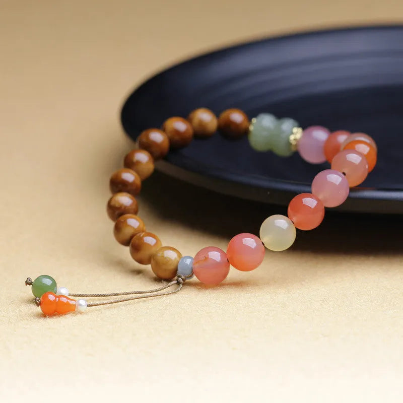 8mm Cook With Hetian Jade Agate Bracelet for Women featuring a diamond-shaped persimmon design made from natural Hetian jade agate, a manually crafted Chinese jewellery piece with spiritual significance