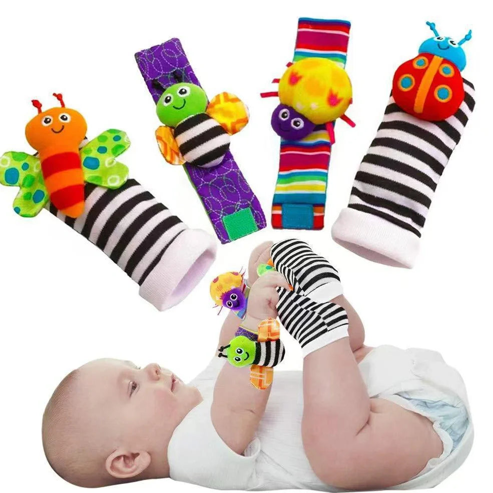 Four fabric baby socks with cartoon designs and ringing feature for infant training