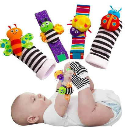 Four fabric baby socks with cartoon designs and ringing feature for infant training