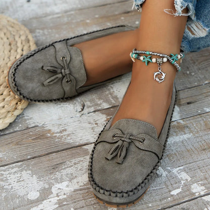 Women's casual suede flat shoes with decorative bow and round toe in apricot colour
