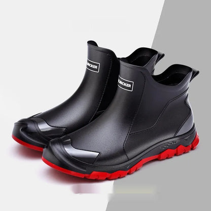 Low-cut solid colour PVC rain boot with round toe and plastic sole.