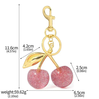 Zinc alloy key ring pendant charm in red or pink with three-dimensional design.