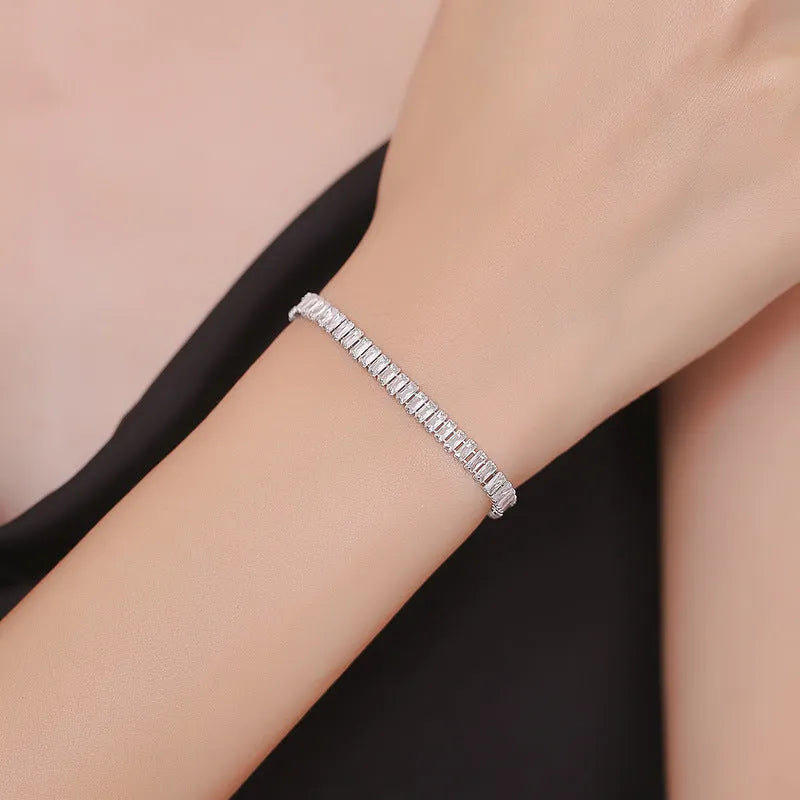 Rectangular geometric brass bracelet with inlaid zircon stones in champagne gold or silver colour