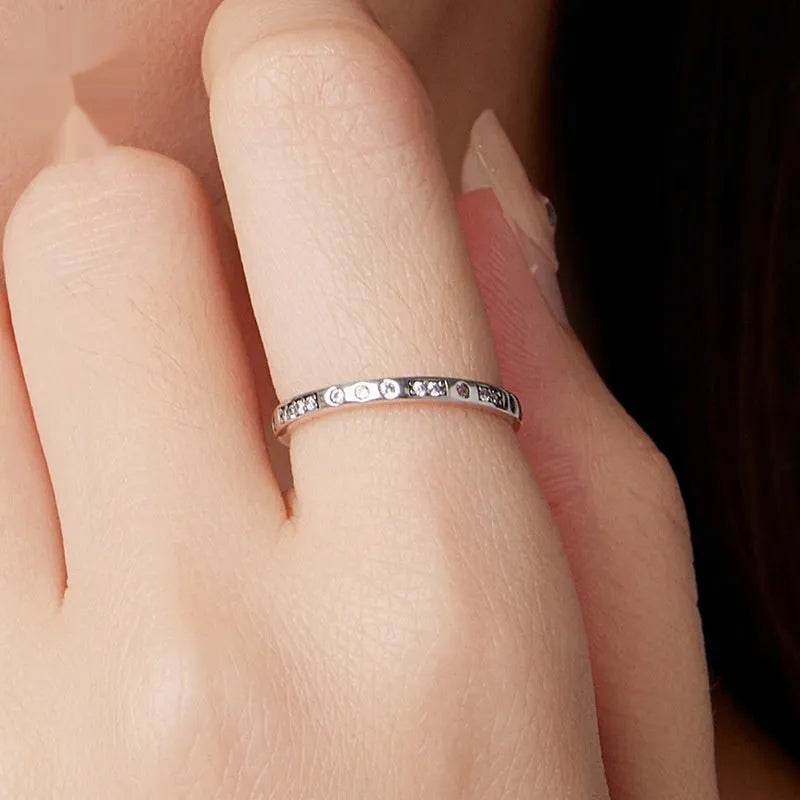 Silver-coloured alloy Moss Password I Love You ring with an oxidised black finish on a simple bracelet band.