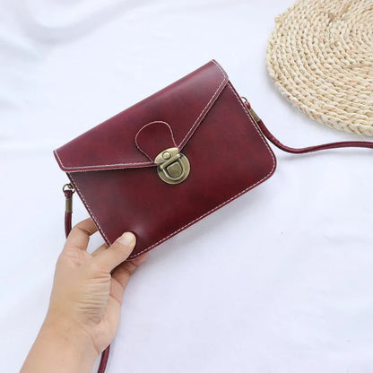 Retro soft brown crossbody messenger bag with a flap and lock closure