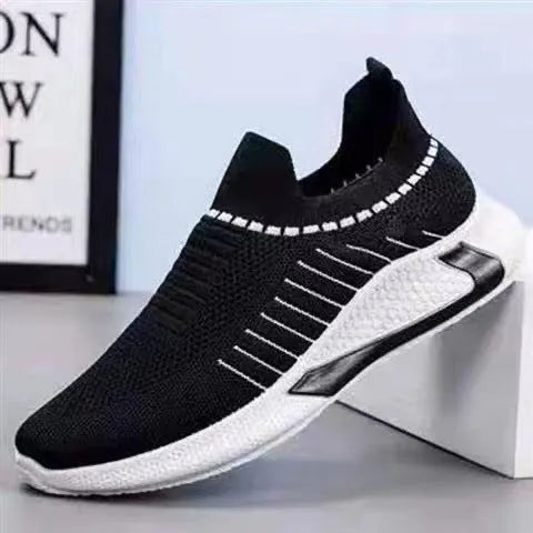 Men's black and white striped mesh slip-on sneakers with lace-up front.