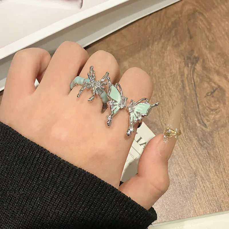 Copper women's ring with Chinese butterfly design and adjustable open loop.