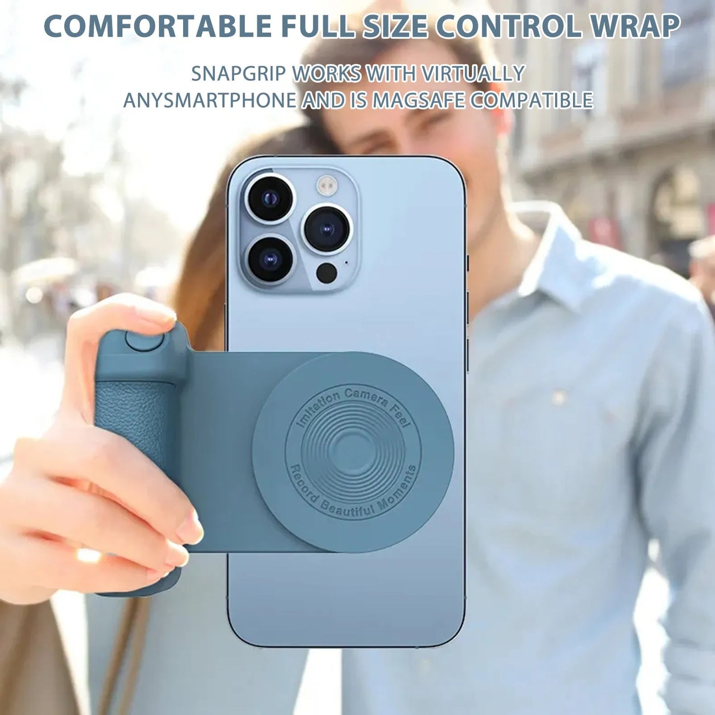 Black magnetic phone camera grip holder with rotatable stand on a table next to a smartphone.