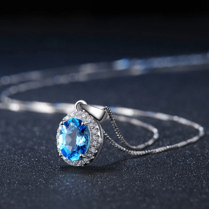 925 sterling silver jewellery set with blue topaz gemstones in geometry pattern, including earrings, ring, pendant, and necklace