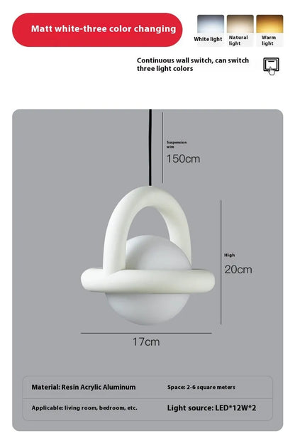 Danish designer hanging line lamp with adjustable cord and matte finish in bedside setting