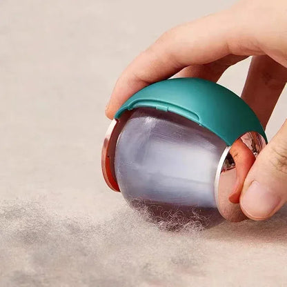 White, pink, green, and deep pink coloured ABS hair removal ball with a handle for pet hair and lint.