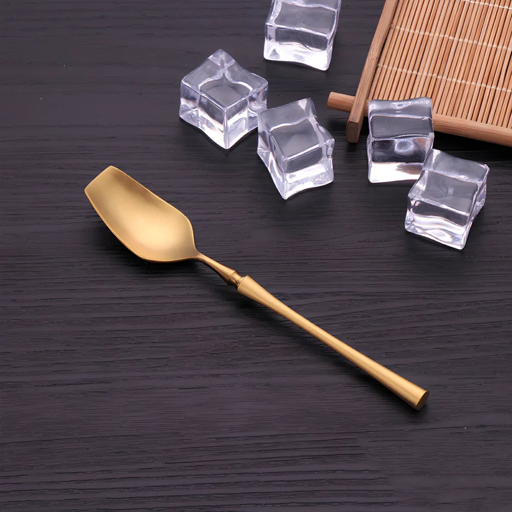 Four-piece stainless steel cutlery set showing main knife, fork, spoon, and teaspoon with mirror finish