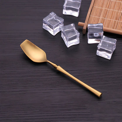 Four-piece stainless steel cutlery set showing main knife, fork, spoon, and teaspoon with mirror finish