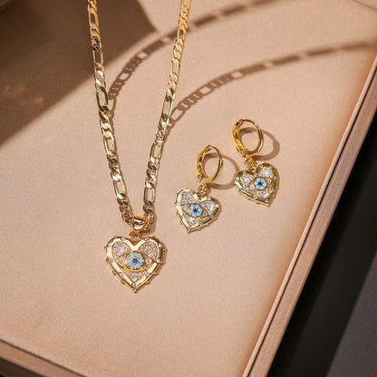 Heart-shaped zircon pendant and earrings set with copper plating and real gold accents