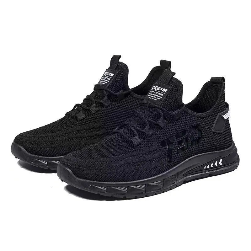 Low-top black mesh sneakers with a flat plastic sole and shallow cut design on a white background.