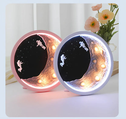 Moon Astronaut wireless Bluetooth speaker in white or pink with card insertion slot and USB port