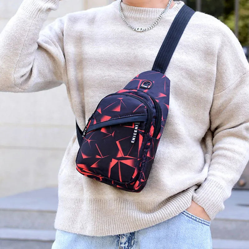 Men's sling chest bag in blue with earphone hole, crossbody strap, and zipper pockets, measuring 17cm wide.