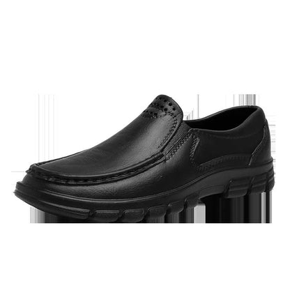 Men's black and brown slip-on work shoes with a mid-top, platform heel, and round toe.