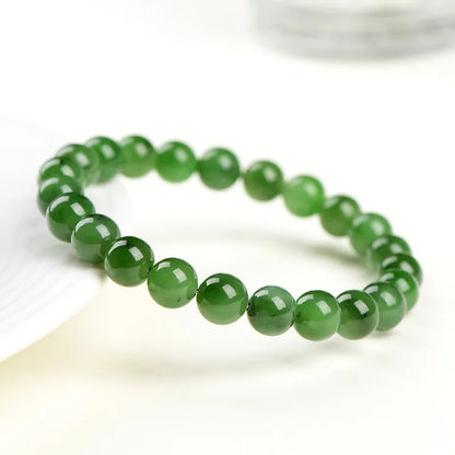 Natural jasper ball bracelet with polished Hetian jade beads in multiple sizes from 4mm to 12mm on wrist