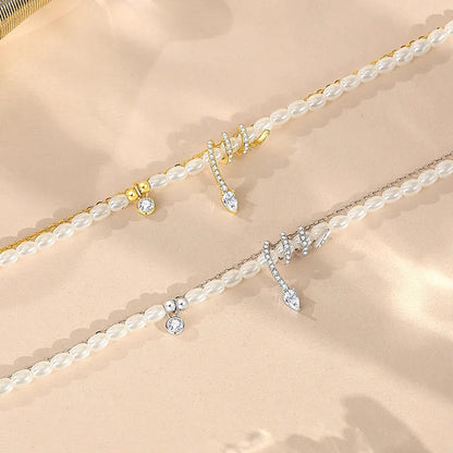 Pearl snake bracelet in 925 silver with electroplated gold or white gold finish and geometric animal design