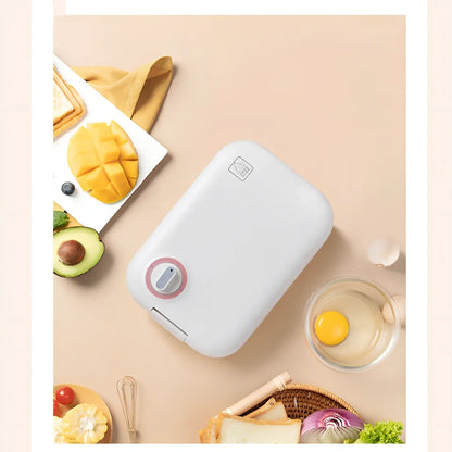 White mini breakfast machine with metal construction measuring 12x11cm for single-person cooking
