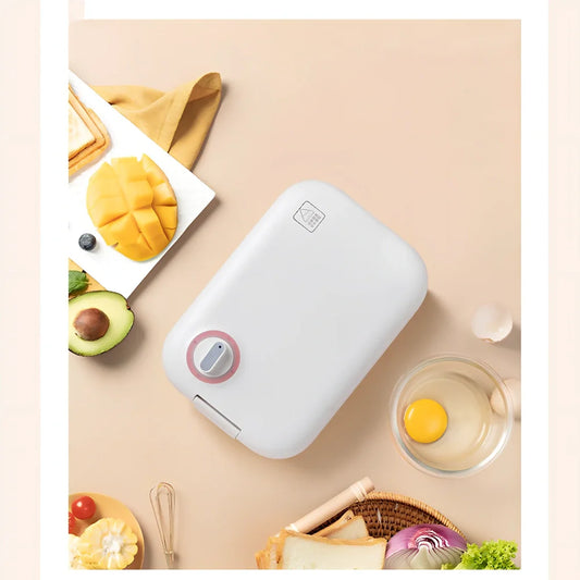 White mini breakfast machine with metal construction measuring 12x11cm for single-person cooking