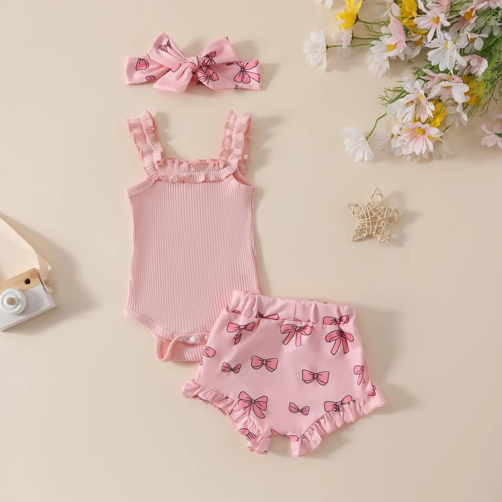 Girls' pink cotton romper and shorts two-piece set with included hair accessory