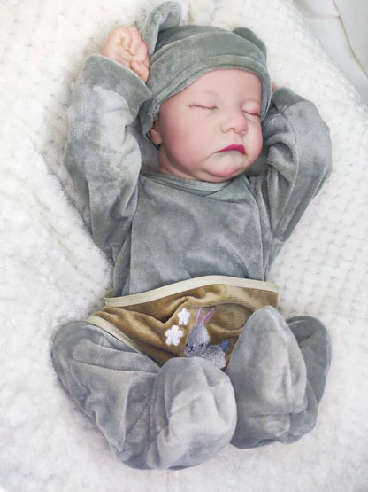 18-inch reborn doll with cloth body and hand-painted vinyl head wearing pink romper