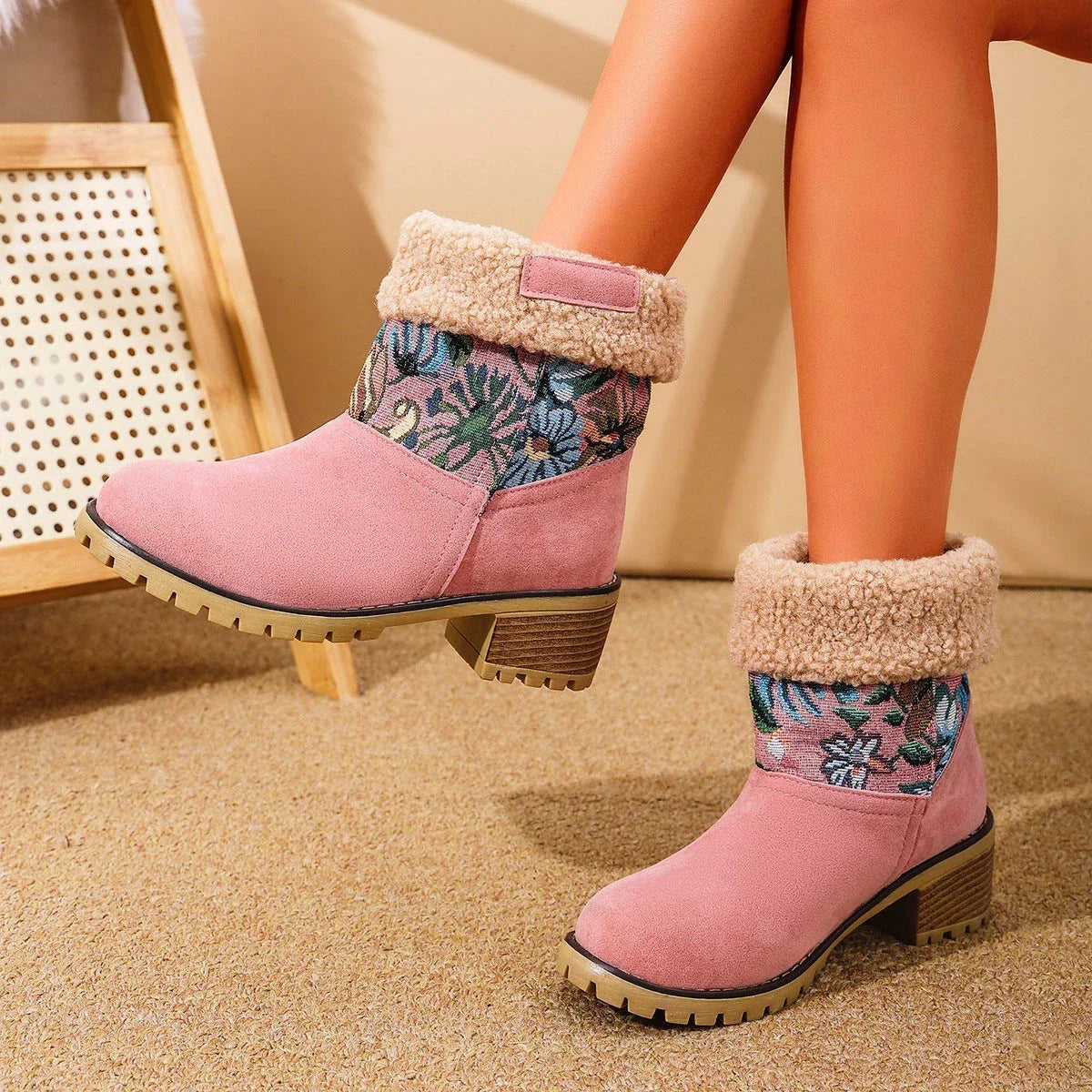 Floral embroidered snow boots in off-white, black, and pink colors with thick square heels and round toe shape