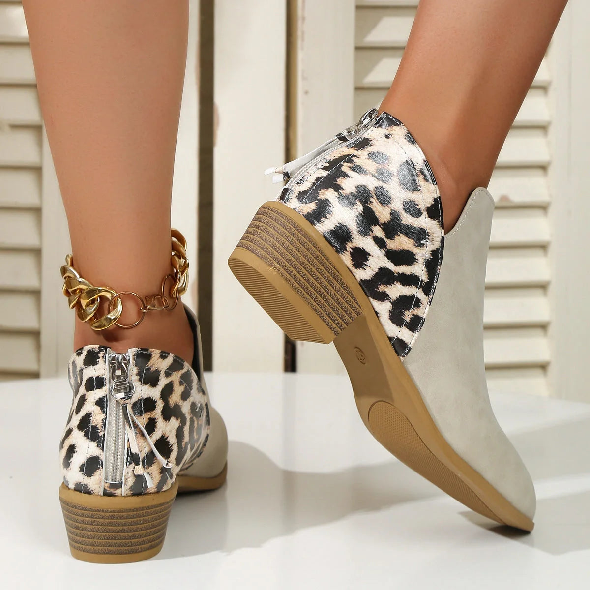 Women's leopard print boots with pointed toe and chunky heel in various colors