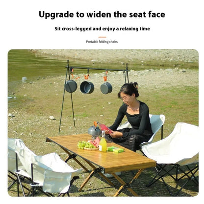 Portable folding camping chair with steel frame and Oxford fabric in outdoor setting