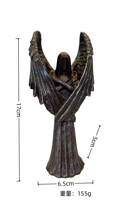 Dark Angel resin statue ornament measuring 6.5 by 5 by 17 centimetres on a wooden surface.