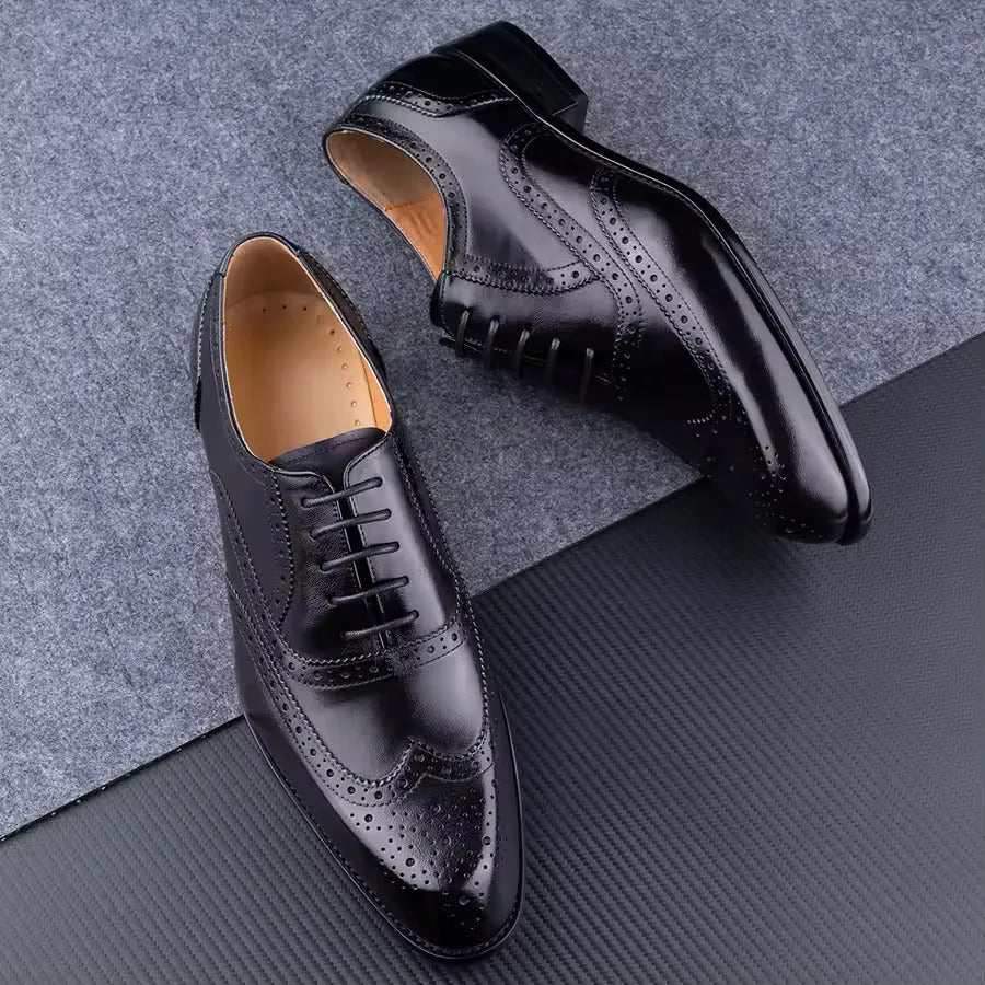 Men's purple leather Oxford shoes with hand-carved design and pointed toe on a rubber sole.