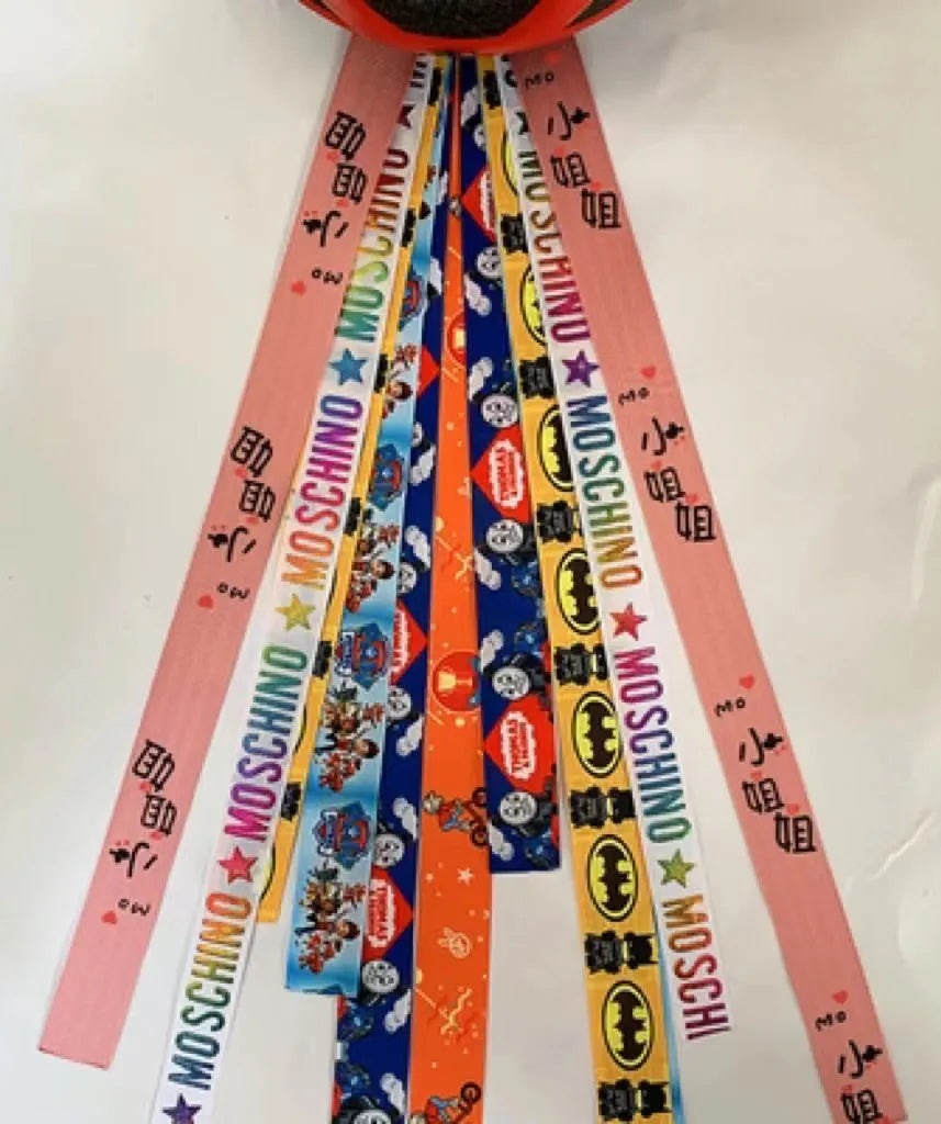 Children's helmet streamer with 60 cm polyester ribbon in colours like apricot and khaki for roller skating and skiing