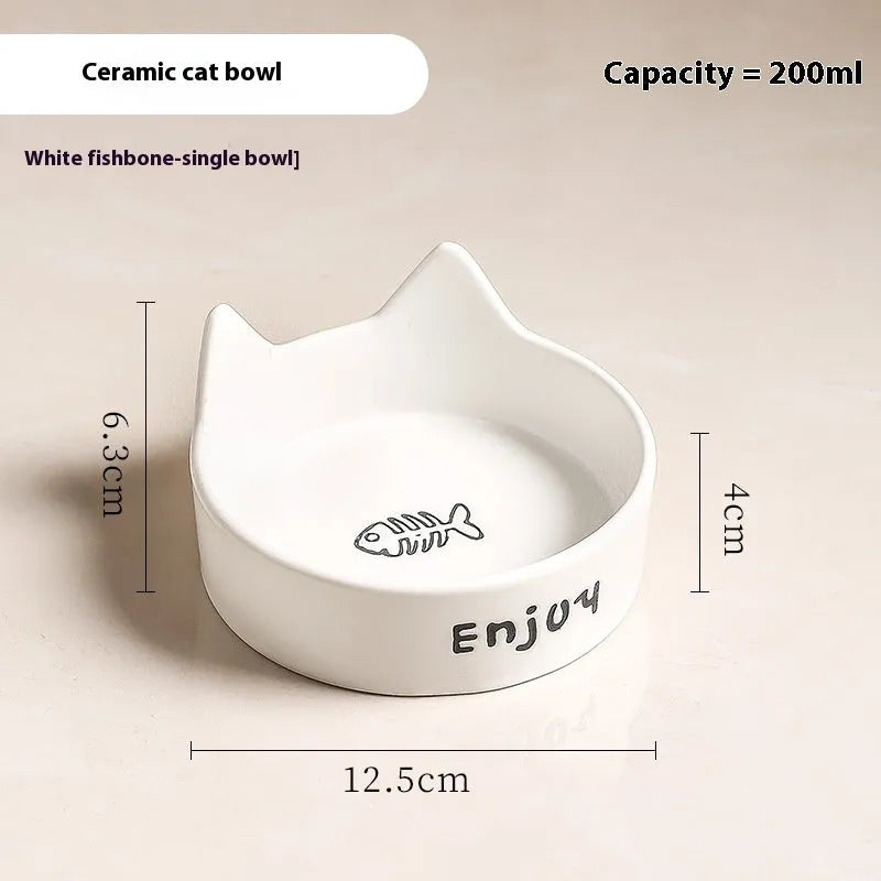 Porcelain cat bowl with anti-tumble wooden frame in pink with a cat paw design