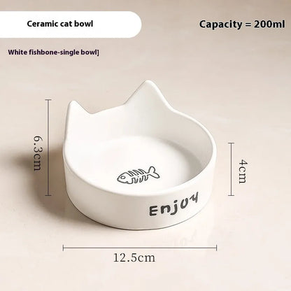 Porcelain cat bowl with anti-tumble wooden frame in pink with a cat paw design