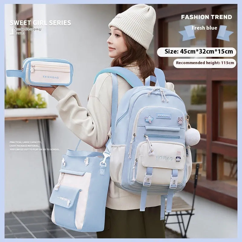 Pink waterproof Oxford cloth school backpack for girls with curved shoulder straps, shown with matching pencil case.