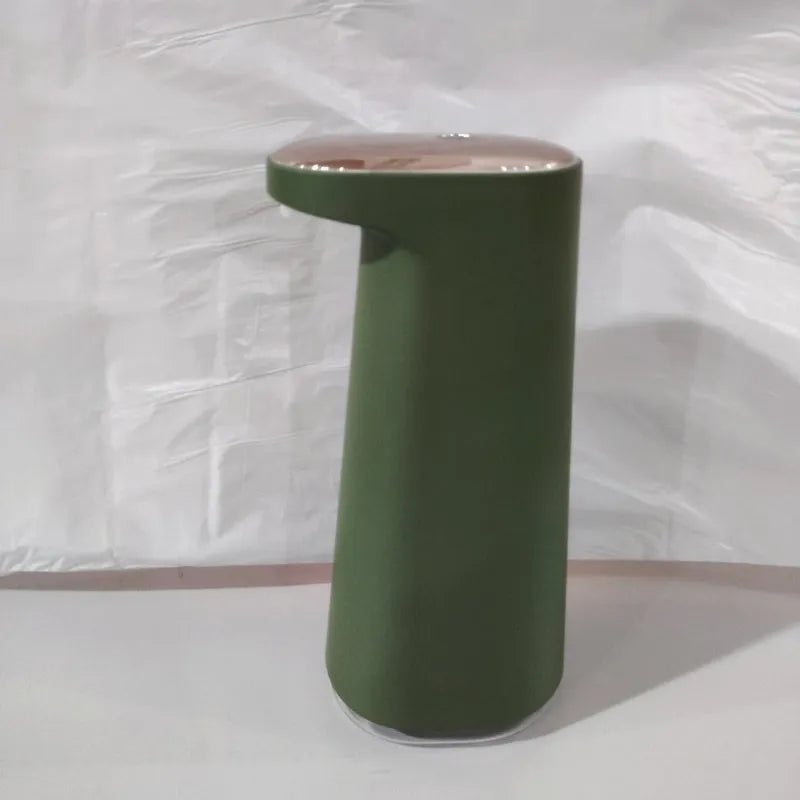 White automatic foam soap dispenser with infrared sensor on a bathroom countertop.