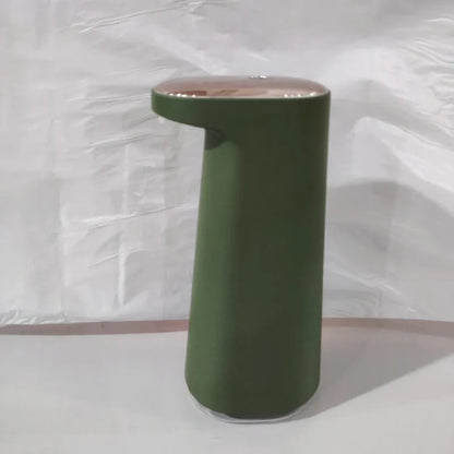 White automatic foam soap dispenser with infrared sensor on a bathroom countertop.