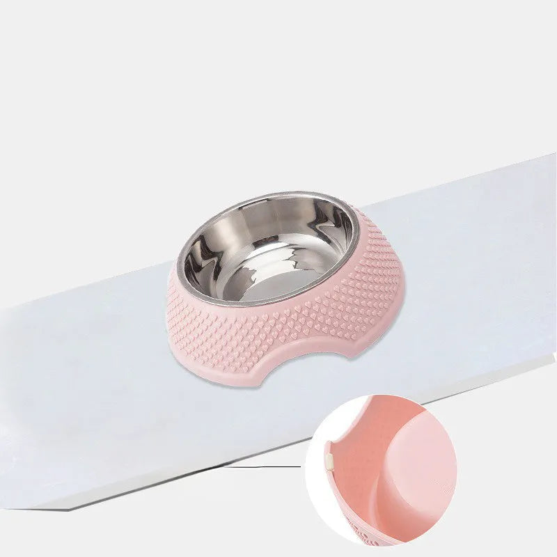 Blue stainless steel pet bowl with non-slip weighted base on a plain surface.
