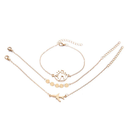 Set of three women's bohemian-style bracelets with heart charms showing an aircraft map design.