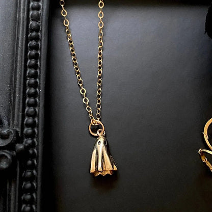 Titanium steel ghost pendant necklace on a 45cm stainless steel chain with electroplated finish, available in cable, figaro, or mini staple styles.