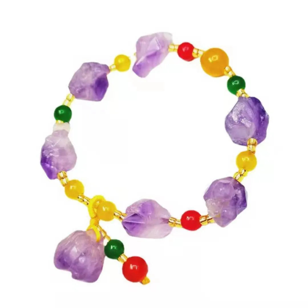Natural shaped purple amethyst bracelet for women with a fu character bead on a white background.