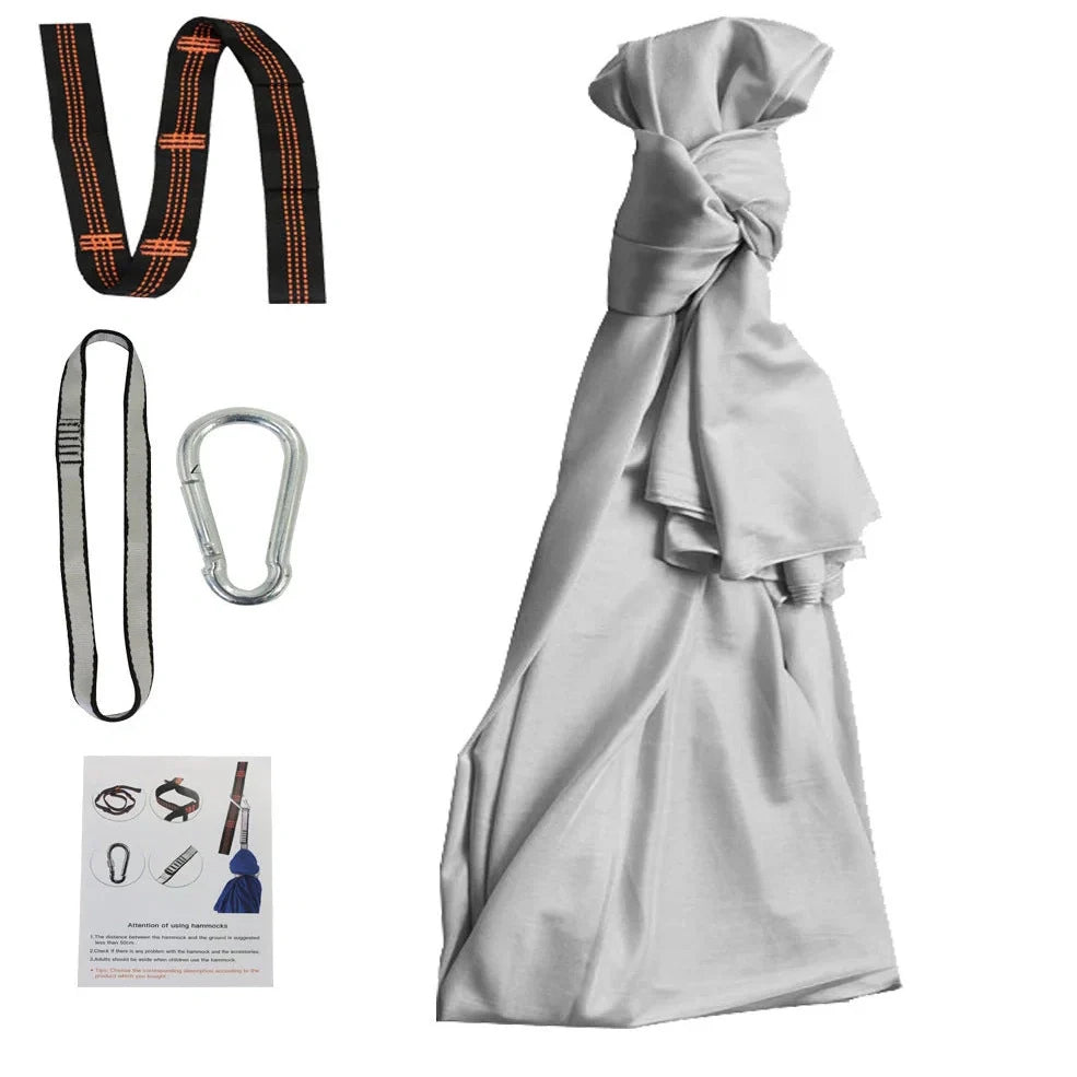 Child in black therapy swing cocoon with multi-loop daisy chain height adjustment system